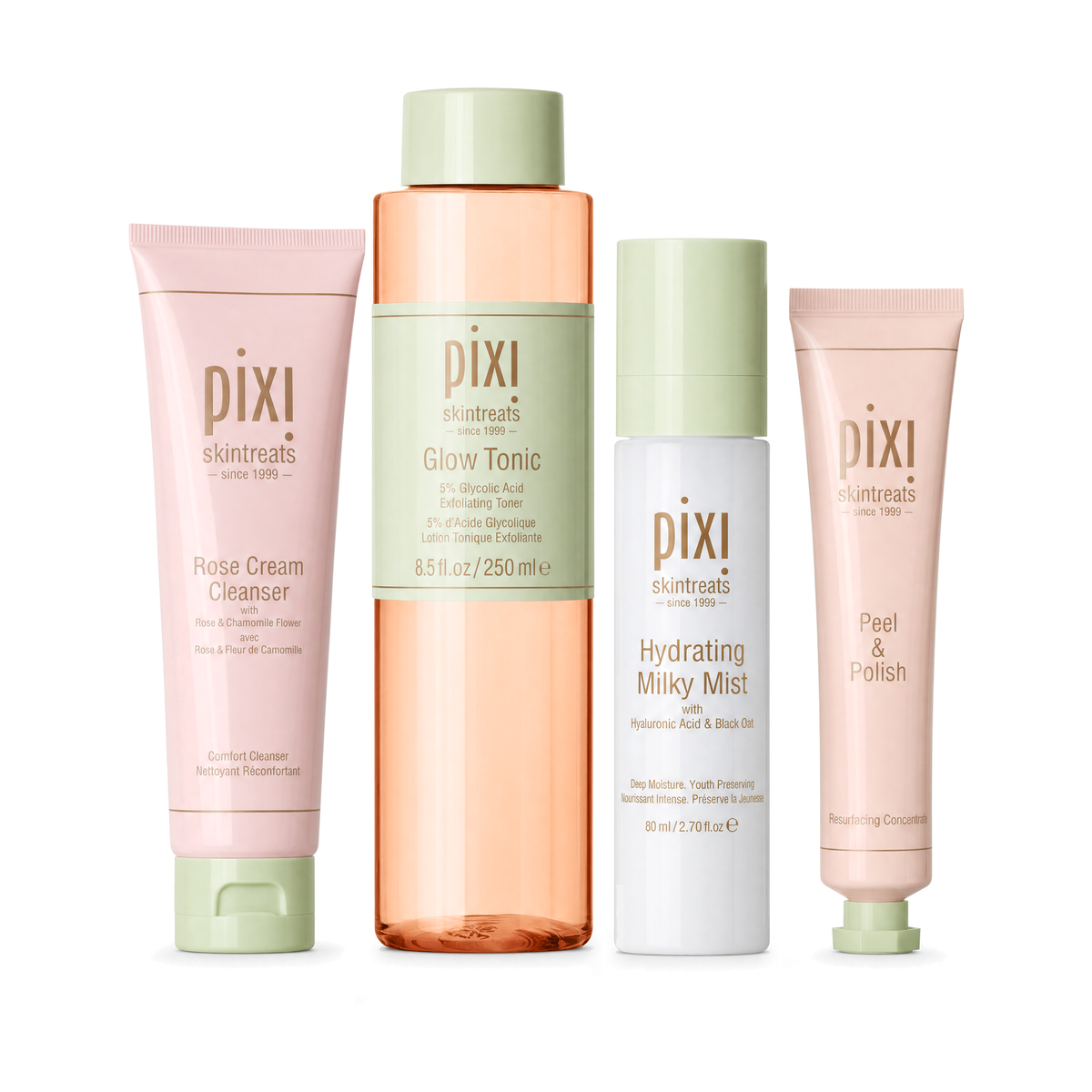 Four Pixi Skintreats skincare bottles and tubes arranged on a white background: Rose Cream Cleanser in a pink tube, Glow Tonic in a peach translucent bottle with a mint cap, Hydrating Milky Mist in a white bottle with a mint cap, and Peel & Polish in a pale pink tube with a mint cap.