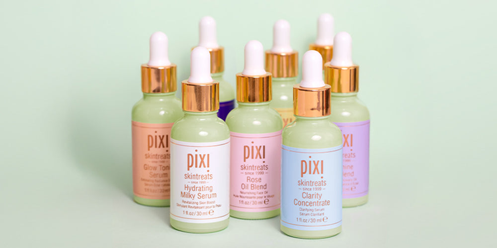 Collection of serums shown on green background - view 1