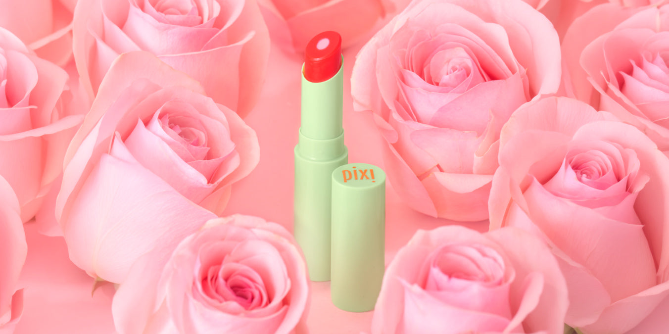 +Rose Lip Nourisher with background of roses
