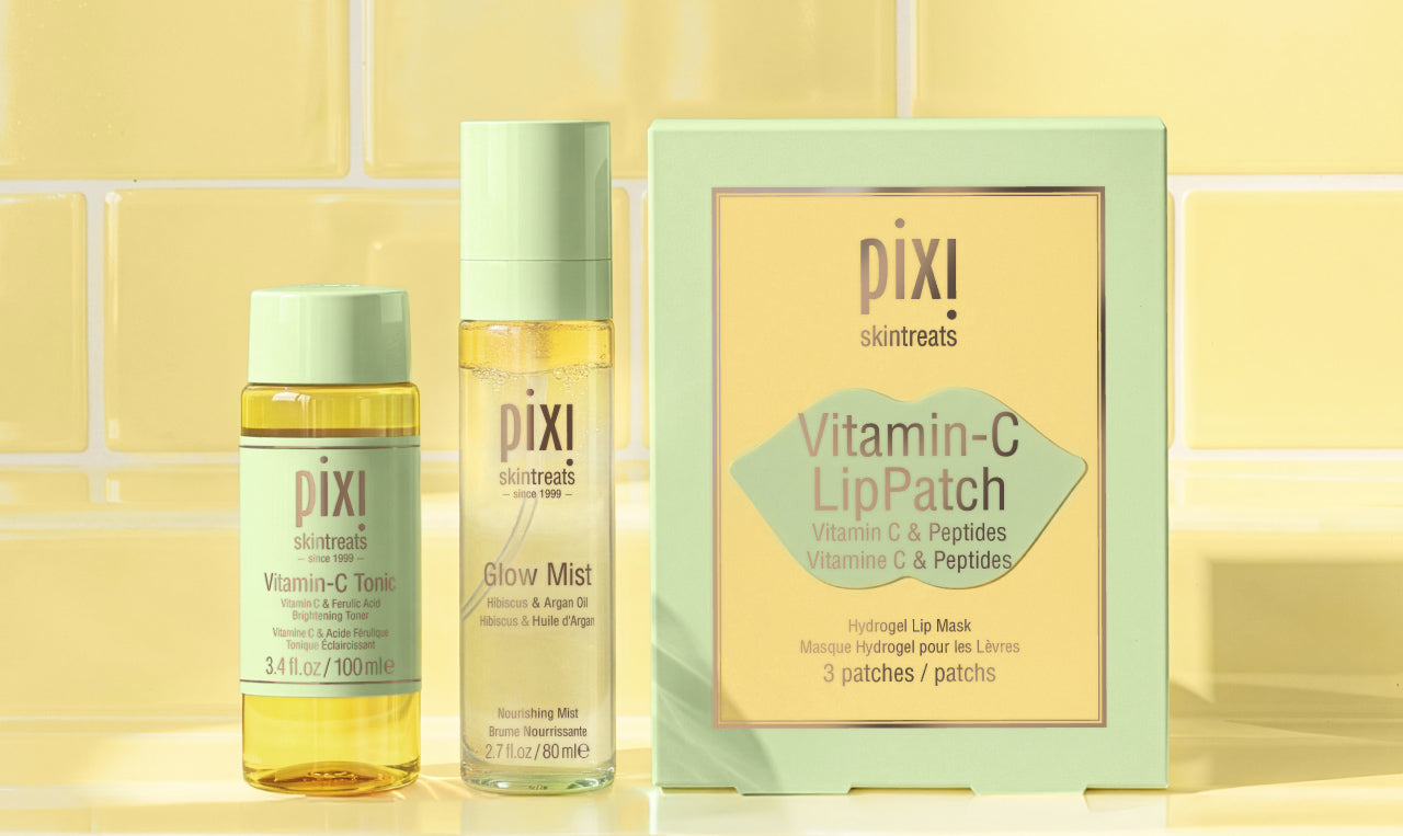 Featuring Vitamin-C Tonic Travel Size, Glow Mist, and Vitamin-C LipPatches (set of 3) on a yellow tiled background - view 1