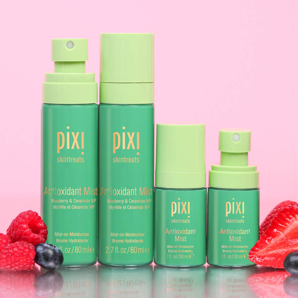 Antioxidant Mists in multiple sizes shown on a pink background with berries view 2