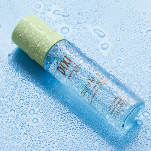 Clarity Mist shown on a blue background with water droplets view 2